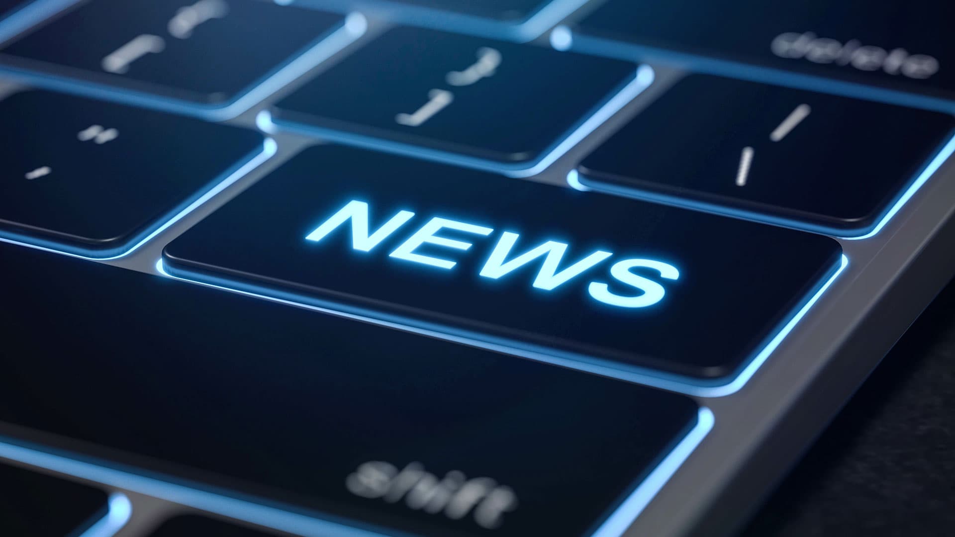 Nahaufnahme einer Tastatur. Auf der Eingabe-Taste steht News